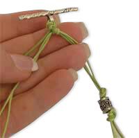 The toggle is attached to the cord ends.